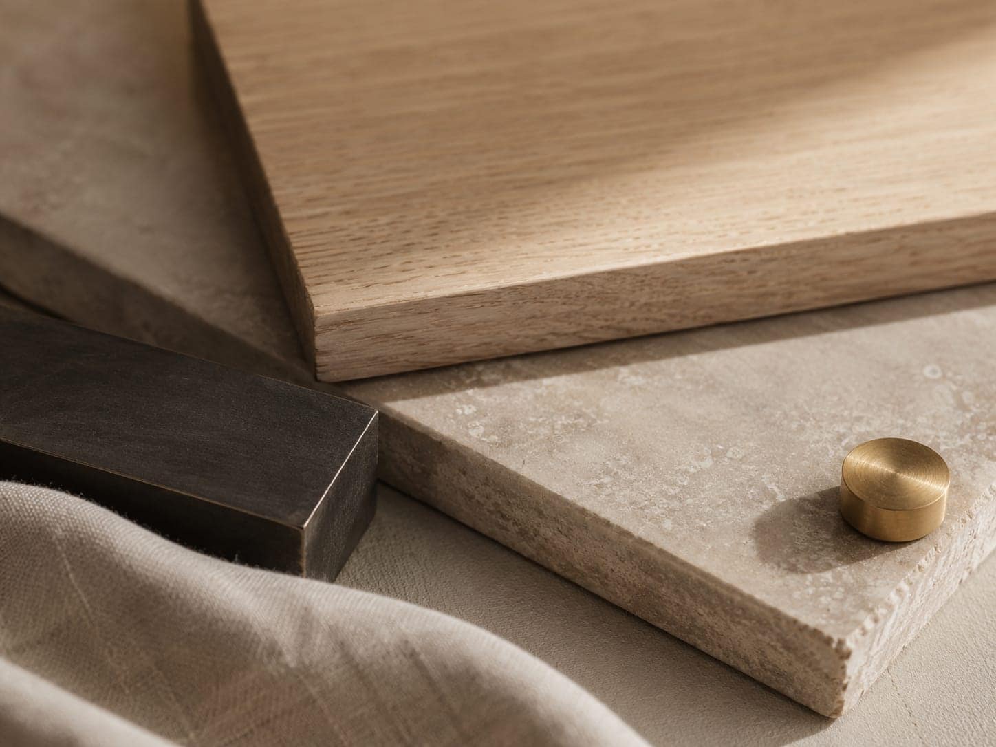 A close study of natural materials: white oak, honed stone, and blackened metal